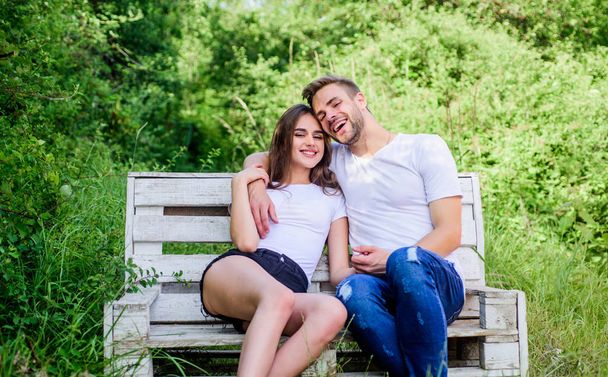 Family weekend. Romantic date in park. Boyfriend girlfriend in love. Trust and intimacy. Youth hang out. Love and romance concept. Lovers cuddling. Couple in love sit on bench. Summer vacation - Photo, Image