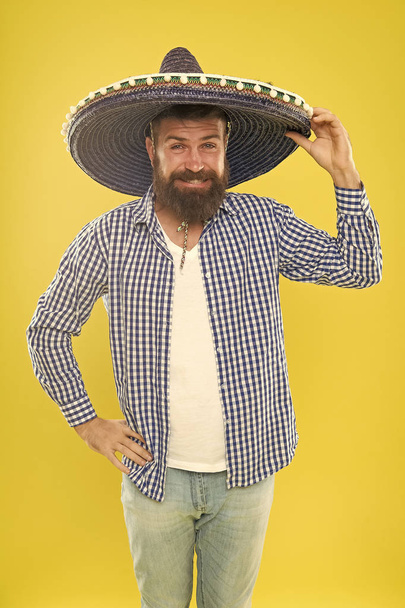 Great party hat. Traditional fashion accessory for mexican costume party. Bearded man in mexican hat. Hipster in wide brim hat. He is in love with mexican style. Mexican man wearing sombrero - Foto, immagini