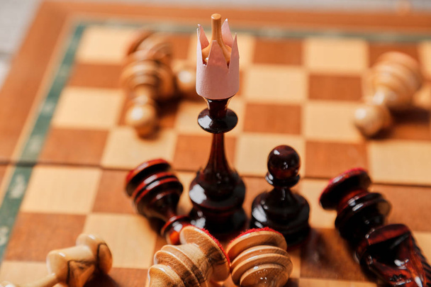 Business battle and strategy. Business game, leader and competition concept. Chess king and losing pieces - Photo, Image