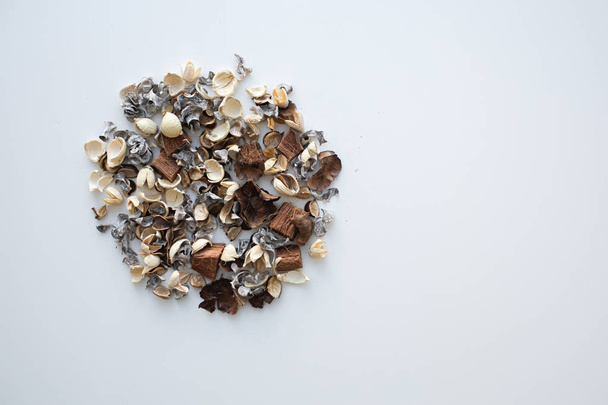 Flowers composition. Frame made of dried rose flowers on white background. Flat lay, top view, copy space - Photo, image
