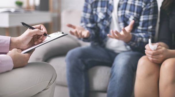 Psychologist noting down problems of young married couple - Photo, Image