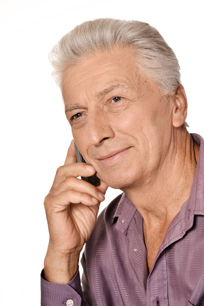 Elderly man speaking on phone - Foto, Imagen