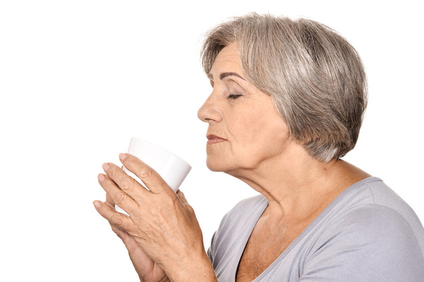 Elderly woman drinking coffee - Foto, immagini