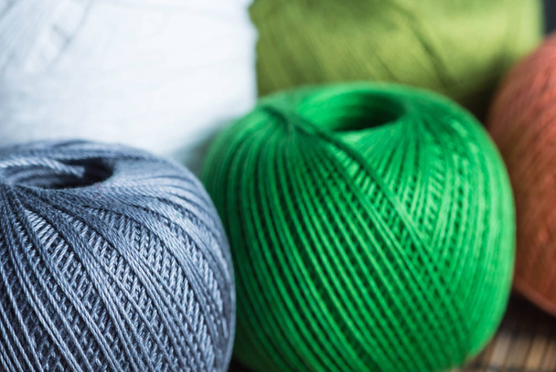 Skeins of yarn of different colors close up - Fotó, kép
