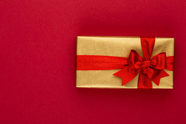 Christmas, holiday present box on red background. - Fotó, kép