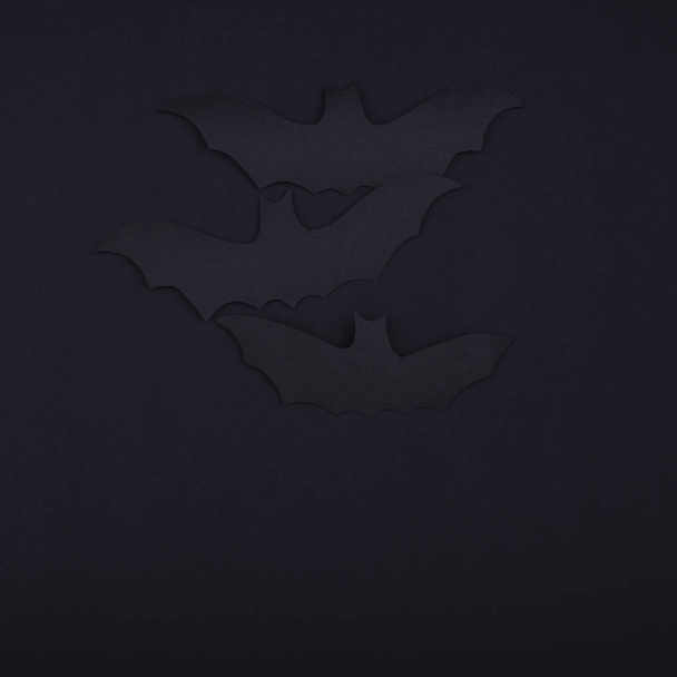 Dark bats on a black background for Halloween decor. - Φωτογραφία, εικόνα