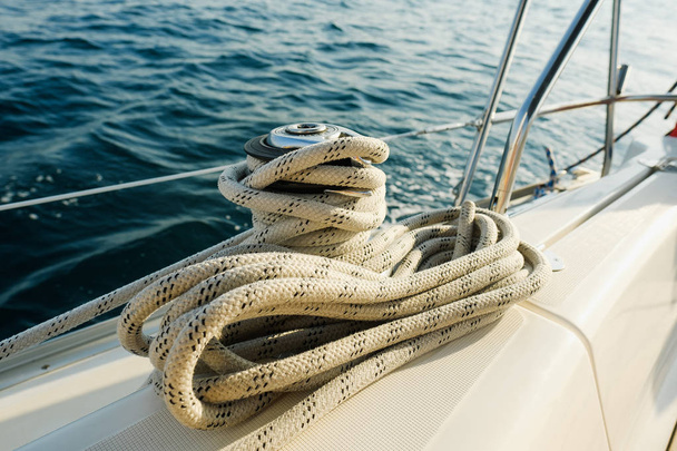 Rope on yacht board on ocean. Sport, vacation, travel, summer activity concept  - Photo, Image