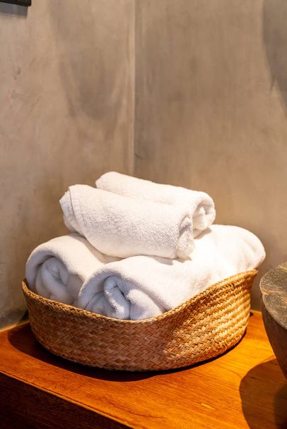 white towel in basket  - Фото, зображення