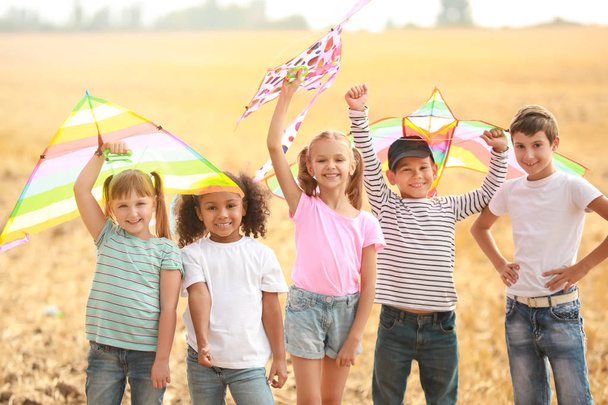 Little children flying kites outdoors - Photo, Image