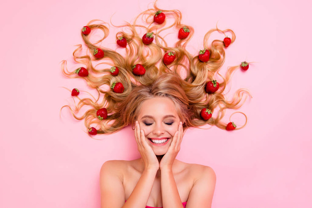 Close up top above high angle view photo beautiful very glad skin condition she her lady lying down among fruits strawberries long hair full vitamins complex eyes closed isolated pink background - Foto, Imagem
