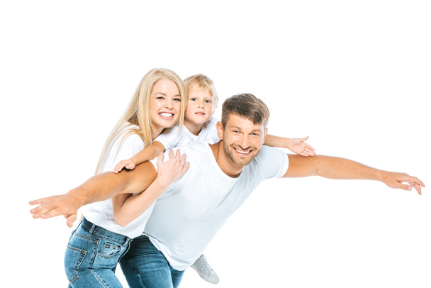 pai feliz e filho com as mãos estendidas perto de mulher atraente isolado no branco
  - Foto, Imagem