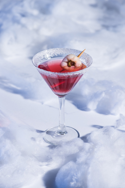 red Halloween cocktail in glass on white surface with cotton wool - Photo, Image