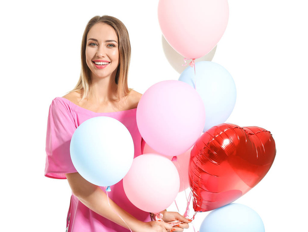 Beautiful young woman with air balloons on white background - Foto, imagen
