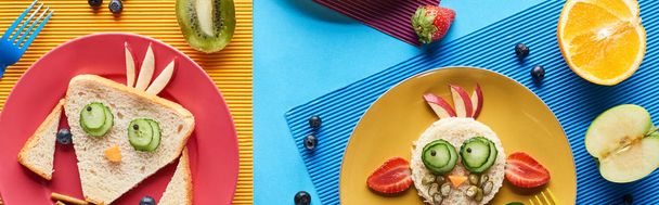 top view of plates with fancy animals made of food on blue and yellow background, panoramic shot - Photo, Image