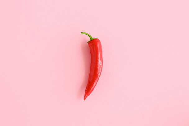 Red chili pepper on color background - Photo, image