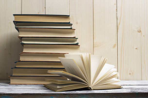 Open book, hardback books on wooden table. Back to school. Copy space - Foto, Bild