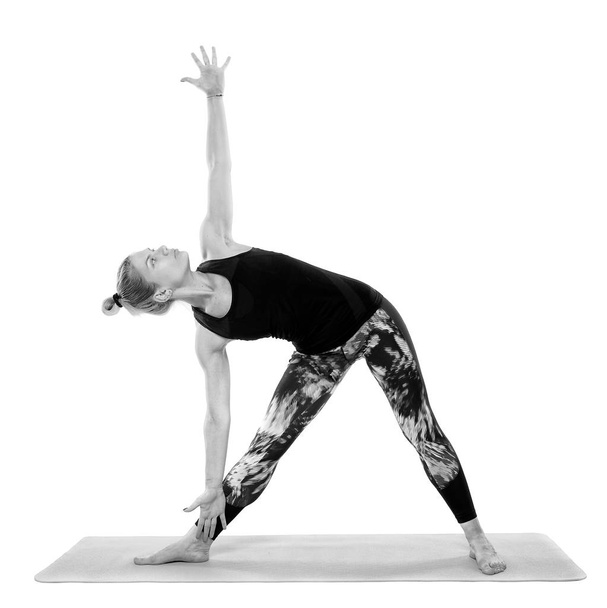 Woman yoga teacher in various poses, isolated on white background - Foto, Bild