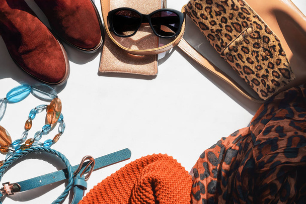 Women's accessories lightweight scarf knitted Snood belt on a white background chelsea boots sunglasses handbag Copy space, flat lay - Φωτογραφία, εικόνα