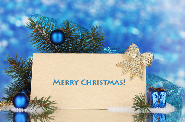 Christmas balls and fir-tree on blue background - Фото, зображення