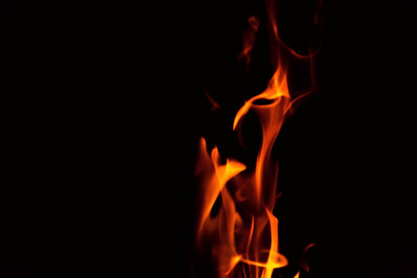 Red and orange fire flames isolated on black background, spooky shapes, large copy space - Photo, image