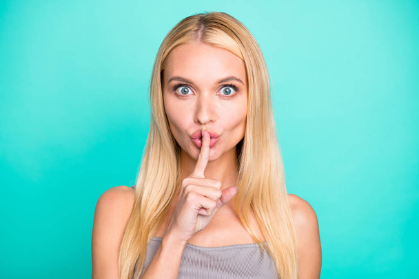 Close-up portrait of her she nice attractive lovely feminine lovable winsome cheerful flirty straight-haired girl showing shh symbol isolated on bright vivid shine green blue turquoise background - Fotó, kép