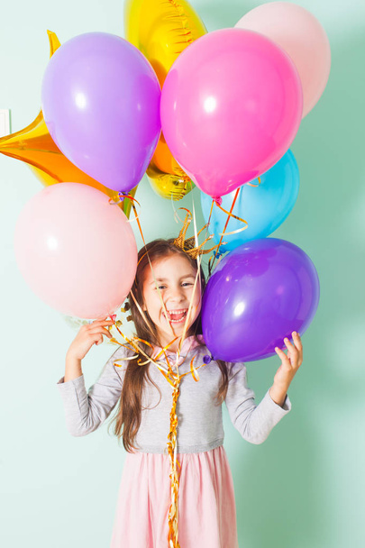 Pretty girl on birthday party with balloons - 写真・画像