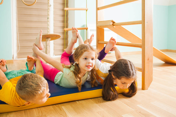 Children playing together in home kids gym - Foto, afbeelding