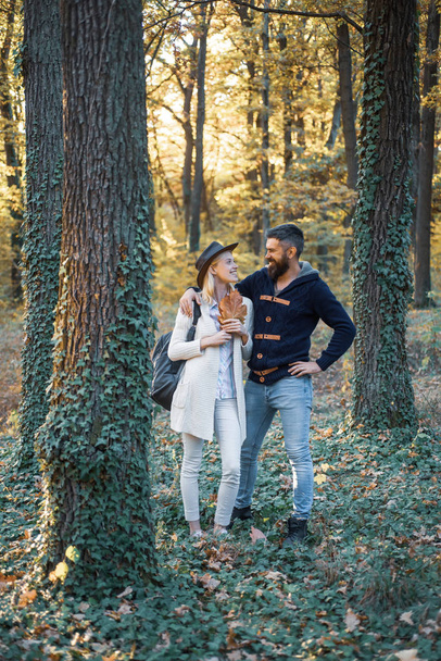 Intimate moments for happy lovers. Autumn and leaf fall Dreams. Romantic Autumn couple posing on nature background. - Foto, imagen