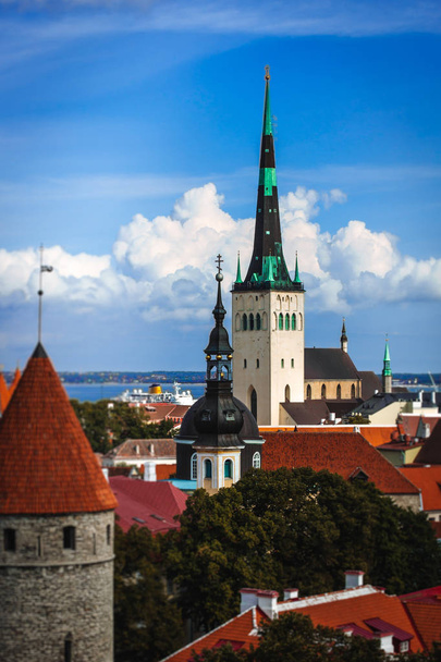 Scenic summer aerial panorama of the Old Town architecture in Tallinn, Estonia, Cloudy blue sky - Photo, Image