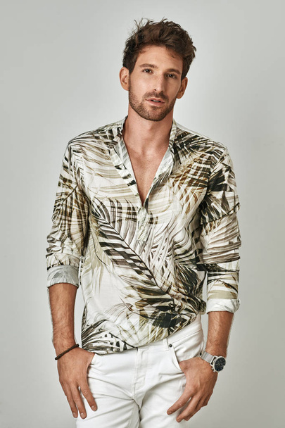 Handsome man in summer outfit posing in studio  - Photo, image