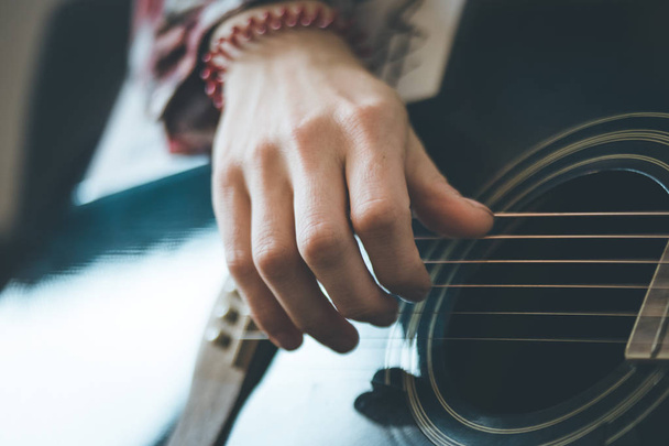 close up of man playing guitar - Φωτογραφία, εικόνα