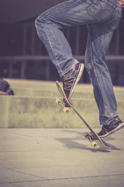 man in  sneakers with a skateboard  - Zdjęcie, obraz