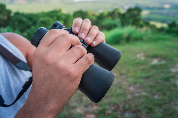Closeup of male hands with binoculars - Valokuva, kuva