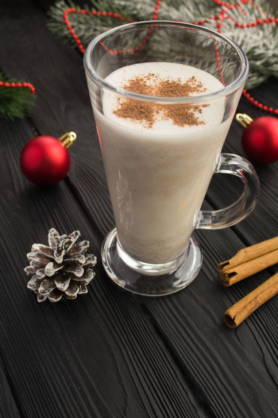 Christmas  tradition eggnog and  christmas composition on the black wooden background. Vertical location. - Photo, Image