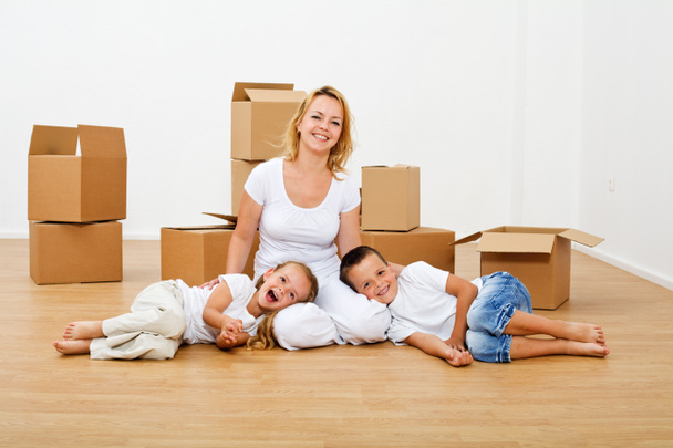 Happy people moving into a new house - Photo, Image
