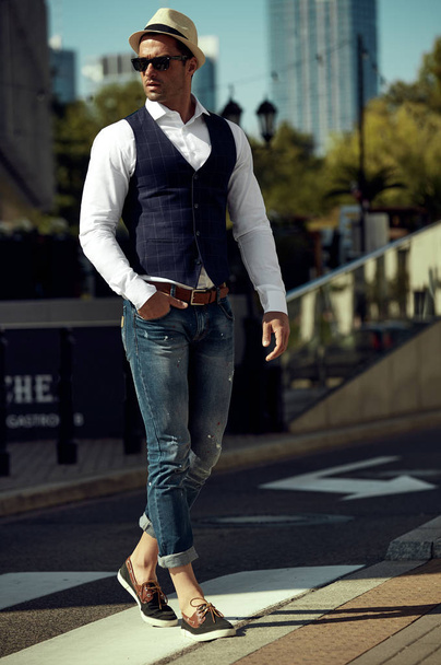 Handsome man in daily casual outfit walking on the street - Photo, Image