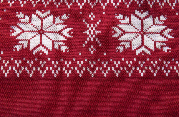 Knitting texture with christmas snowflakes. Winter pattern ornament - Photo, Image