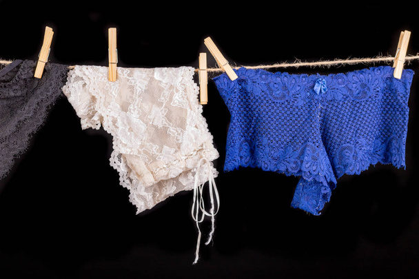 Linen drying on a string. Sexy women's panties pinned to a strin - Foto, afbeelding