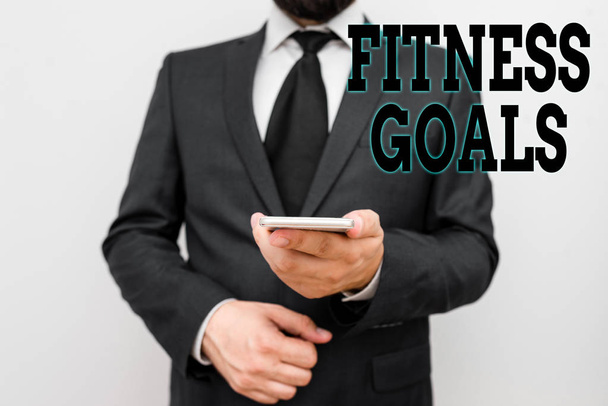 Texte manuscrit Fitness Goals. Concept signifiant Loose fat Construire le muscle Obtenir plus fort Conditionnement
. - Photo, image