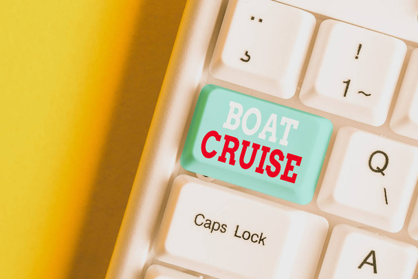 Writing note showing Boat Cruise. Business photo showcasing sail about in area without precise destination with large ship White pc keyboard with note paper above the white background. - Photo, Image
