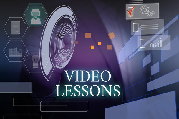 Writing note showing Video Lessons. Business photo showcasing Online Education material for a topic Viewing and learning Male wear formal suit presenting presentation smart device. - Photo, Image