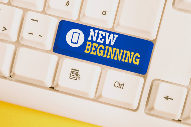 Handwriting text New Beginning. Concept meaning Different Career or endeavor Starting again Startup Renew White pc keyboard with empty note paper above white background key copy space. - Φωτογραφία, εικόνα