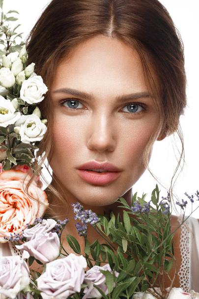 Beautiful woman with classic nude make up, light hairstyle and flowers. Beauty face. - Photo, image