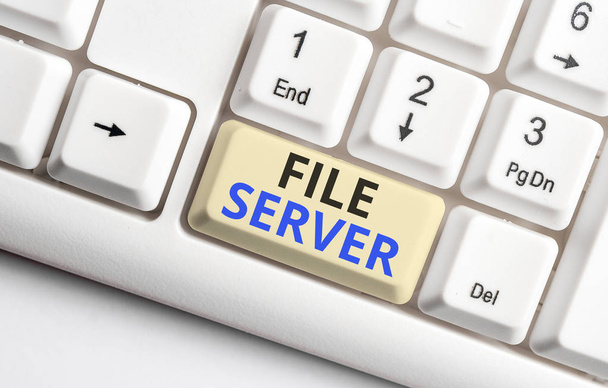 Text sign showing File Server. Conceptual photo device which controls access to separately stored data White pc keyboard with empty note paper above white background key copy space. - Photo, Image