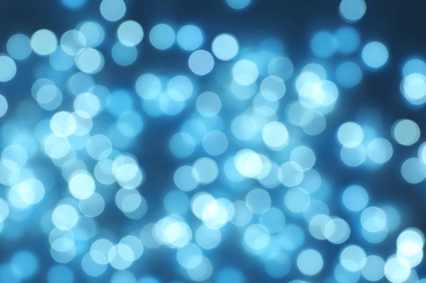 Blurred view of Christmas lights on dark background - Foto, Imagen