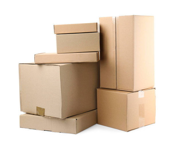 Pile of cardboard boxes on white background - Fotó, kép