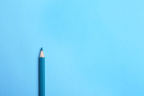 Colorful pencil on light blue background, top view. Space for text - Zdjęcie, obraz