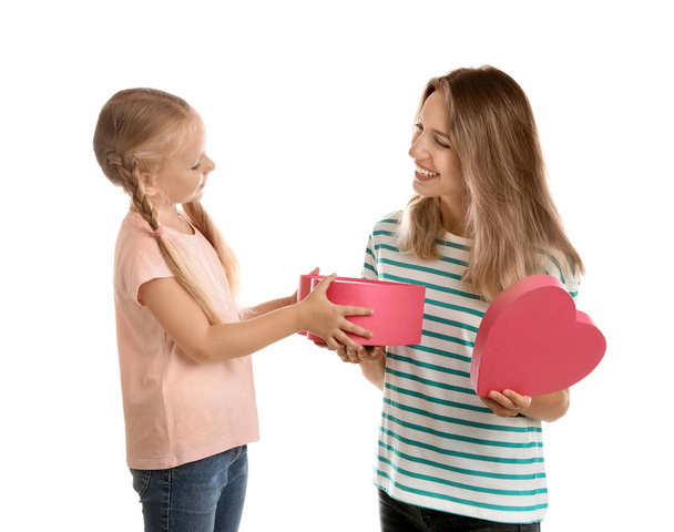 Little daughter congratulating her mom on white background. Happy Mother's Day - Valokuva, kuva
