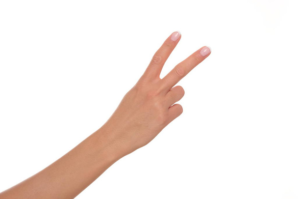 Mano femenina mostrando dos dedos
. - Foto, Imagen
