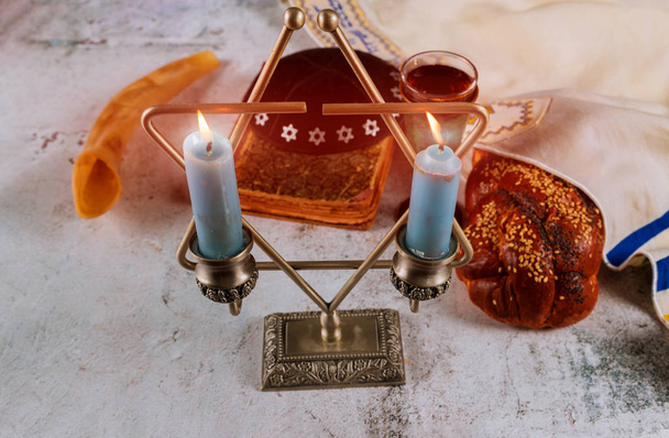Sabbath Jewish Holiday challah bread and candelas on wooden table - Photo, Image